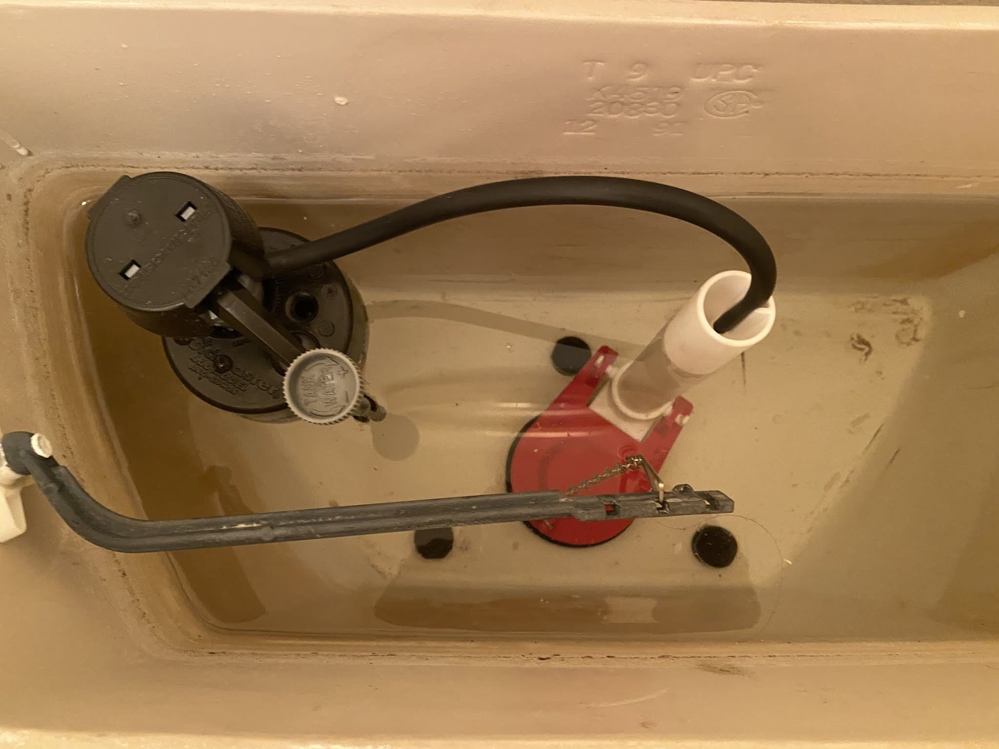 A drain cleaning machine set up at a tub to clear a blocked line